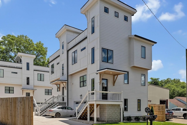 view of front of house featuring fence