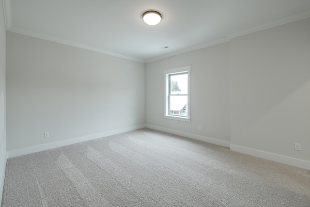 carpeted empty room with ornamental molding