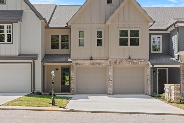 townhome / multi-family property featuring a garage