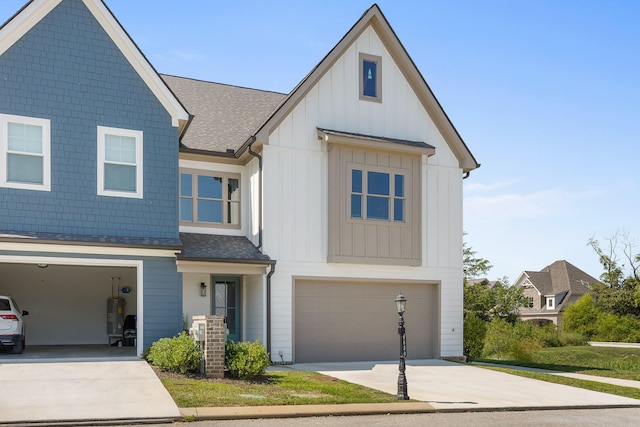 view of front of home featuring central AC unit and a garage