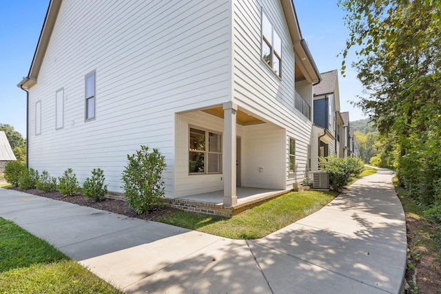 view of property exterior with central AC
