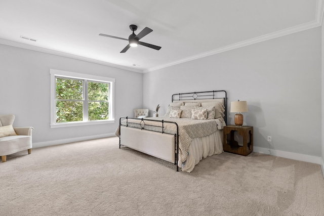 bedroom with carpet floors, ornamental molding, and ceiling fan