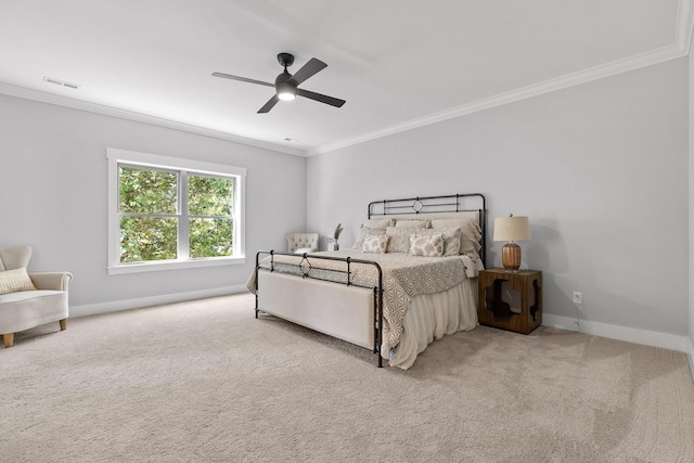carpeted bedroom with baseboards, a ceiling fan, visible vents, and ornamental molding