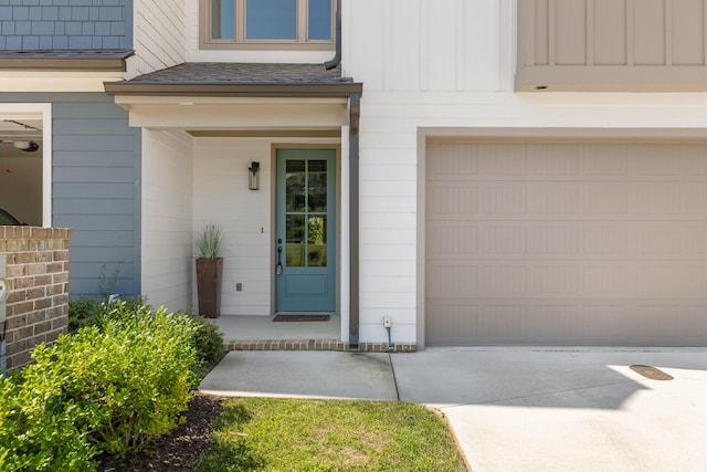 doorway to property with a garage