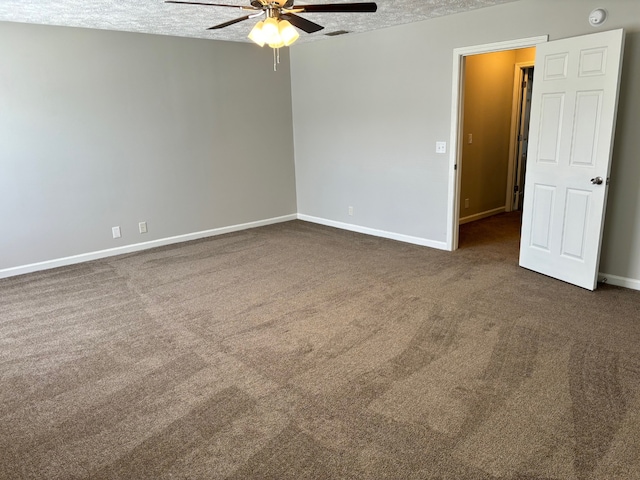 carpeted empty room featuring a textured ceiling and ceiling fan