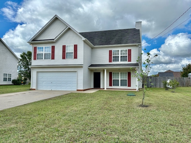 view of front of home featuring a garage and a front lawn