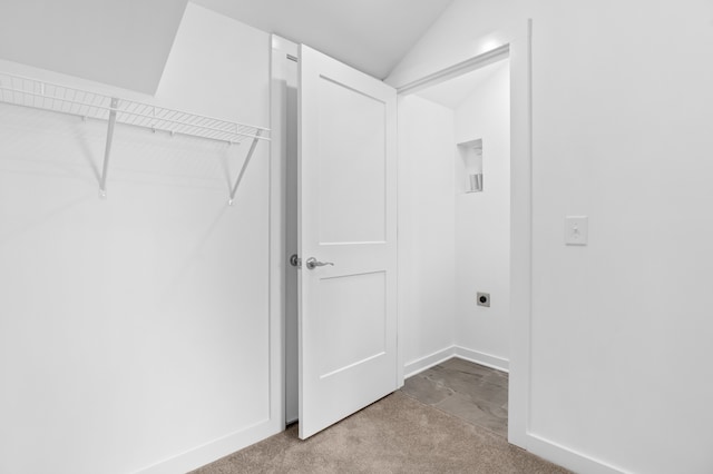 laundry area with light colored carpet and hookup for an electric dryer