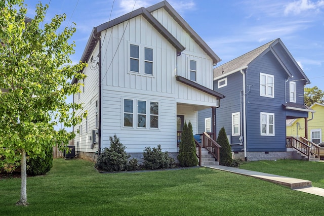 view of front of home featuring central AC and a front yard