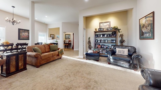 living room with carpet and a chandelier