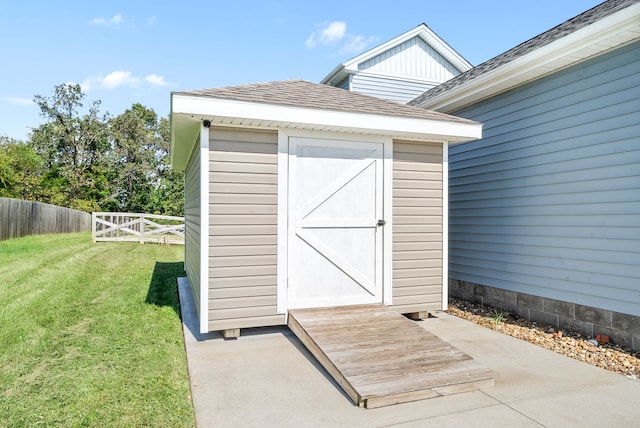 view of outdoor structure featuring a lawn