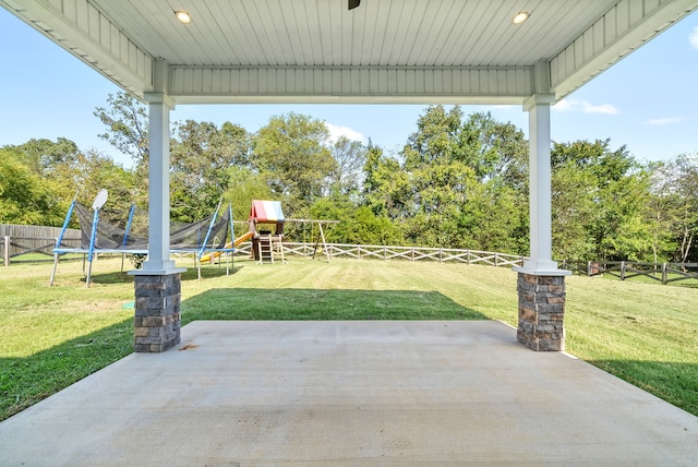 view of patio / terrace with a playground and a trampoline