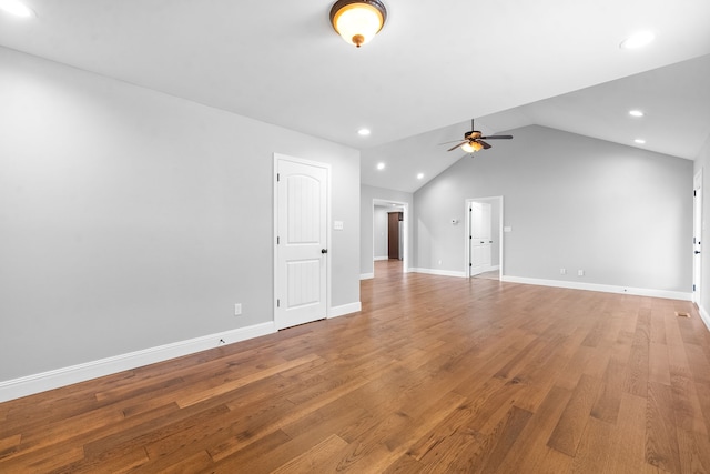 spare room with vaulted ceiling, ceiling fan, and hardwood / wood-style flooring