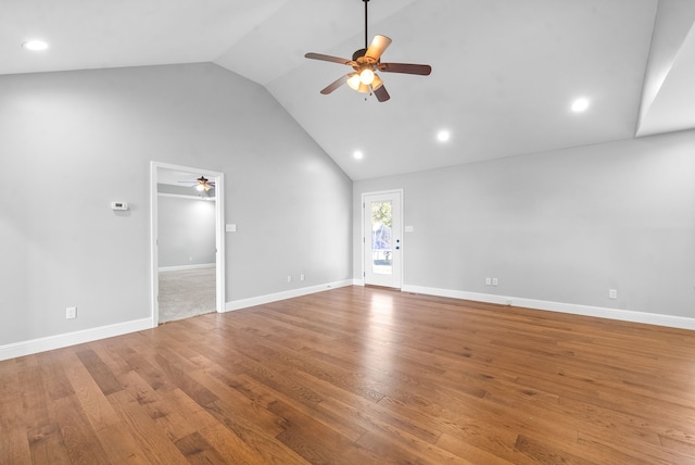 unfurnished living room with ceiling fan, hardwood / wood-style flooring, and high vaulted ceiling