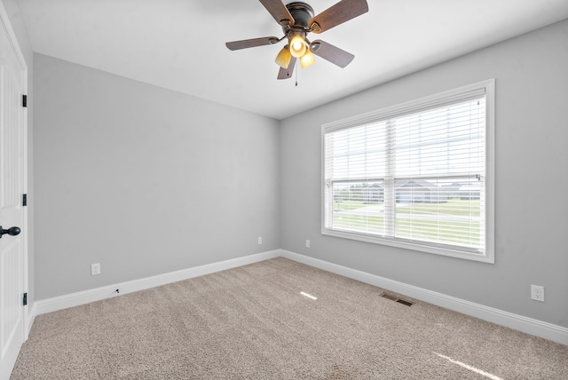 carpeted empty room with ceiling fan