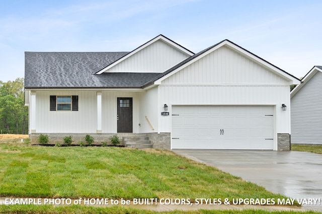 view of front of house featuring a front lawn and a garage