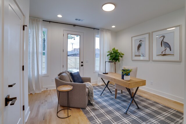 home office with light wood-type flooring