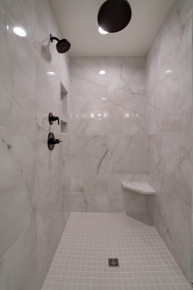 bathroom with a tile shower