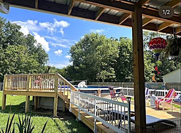 exterior space featuring a fenced in pool