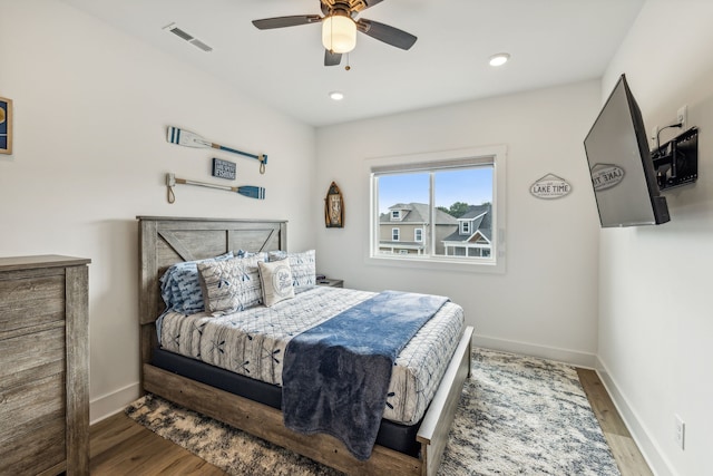 bedroom featuring ceiling fan and hardwood / wood-style floors