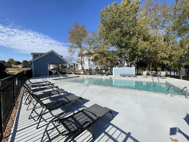 view of swimming pool with a patio area