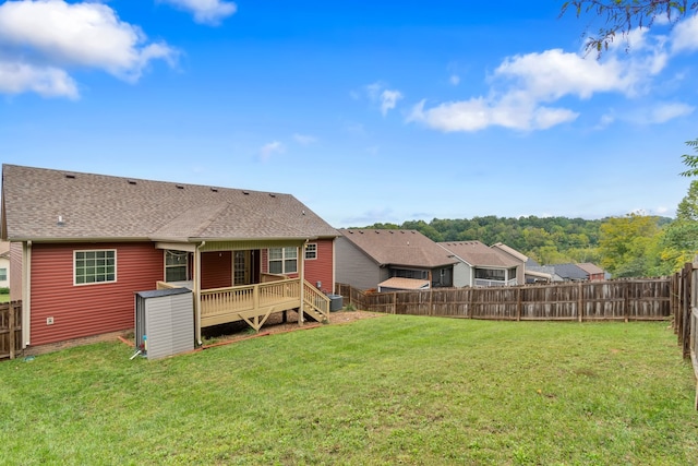 view of yard with a wooden deck