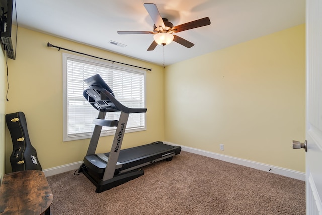 exercise area featuring carpet floors and ceiling fan