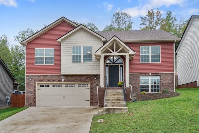 bi-level home with a front yard and a garage