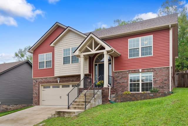 raised ranch with a garage and a front lawn