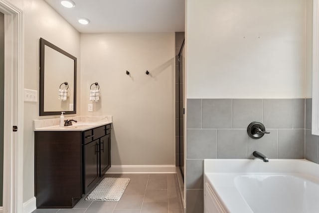 bathroom with vanity, plus walk in shower, and tile patterned floors