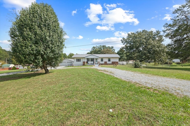 single story home featuring a front lawn