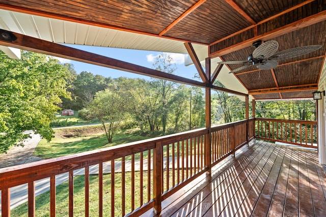 deck featuring a lawn and ceiling fan