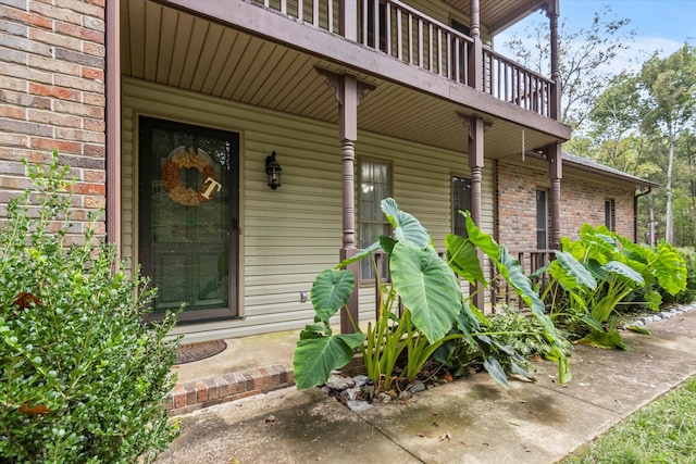 doorway to property featuring covered porch