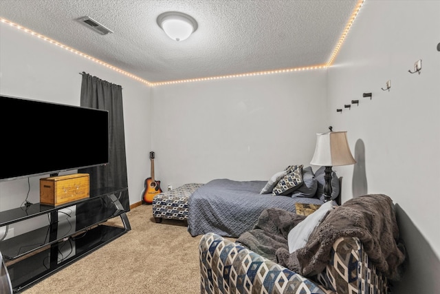 carpeted bedroom with a textured ceiling