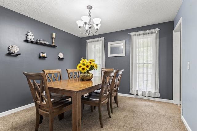 carpeted dining space with a textured ceiling and a notable chandelier