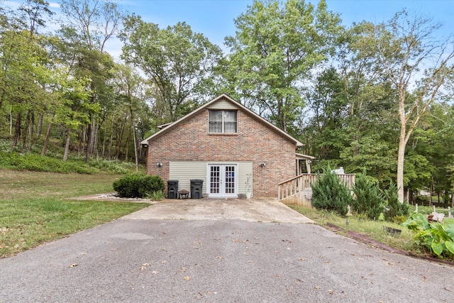 view of property exterior featuring french doors