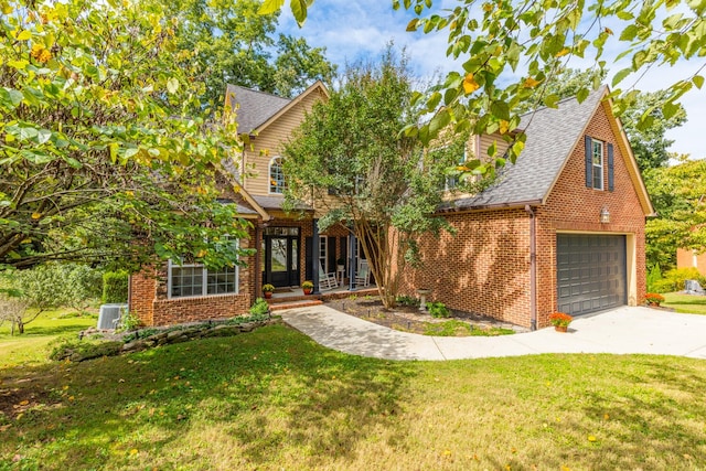 view of front of house featuring a front yard and a garage