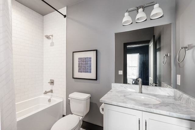 full bathroom featuring vanity, shower / tub combo, and toilet