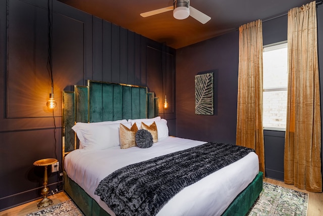 bedroom featuring ceiling fan and hardwood / wood-style flooring