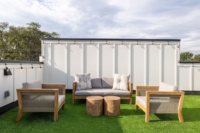 exterior space featuring an outdoor living space and a lawn