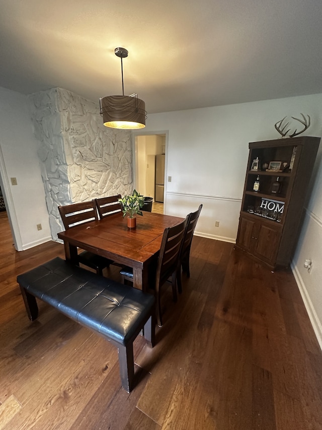 dining area featuring dark hardwood / wood-style flooring