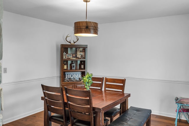 dining room featuring dark wood-type flooring