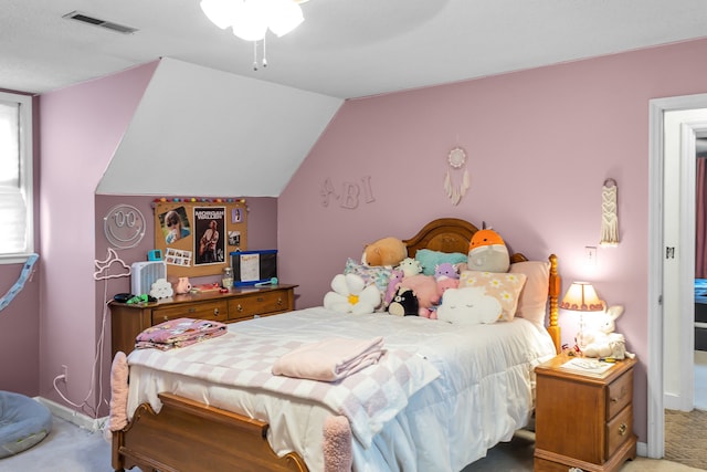 bedroom featuring carpet, ceiling fan, and vaulted ceiling