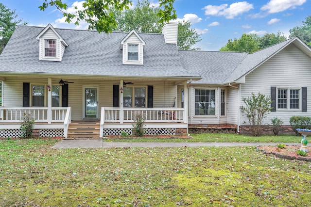 view of front of house with a front yard and a porch