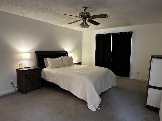 carpeted bedroom featuring ceiling fan and a textured ceiling