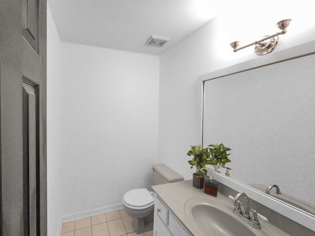 bathroom with tile patterned floors, vanity, and toilet