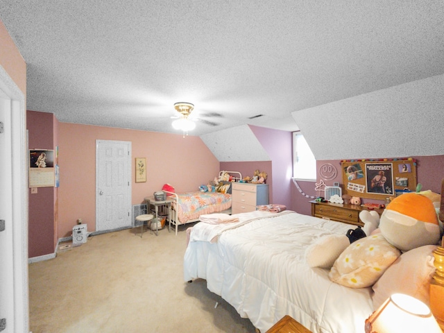 bedroom featuring a textured ceiling, lofted ceiling, light carpet, and ceiling fan