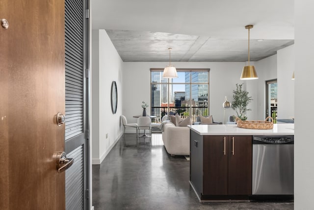 kitchen with dark brown cabinetry, dishwasher, and hanging light fixtures