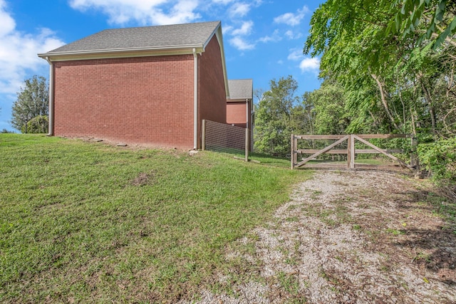 view of home's exterior featuring a yard