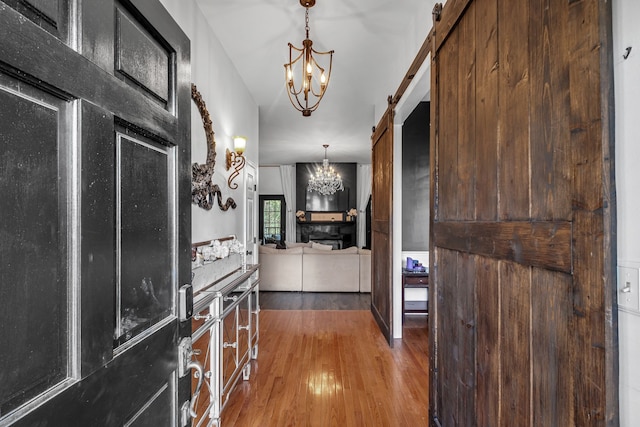 interior space featuring wood-type flooring and a barn door