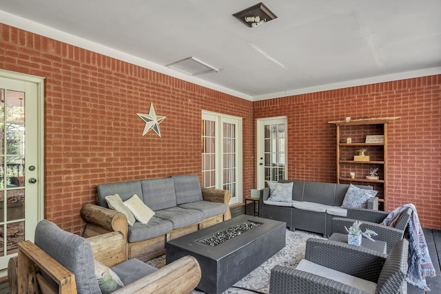 interior space featuring brick wall